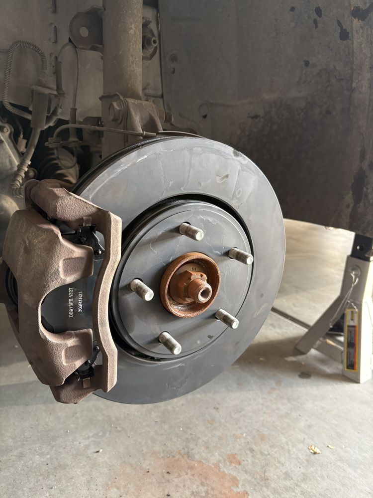 Fresh brake rotor and caliper installed