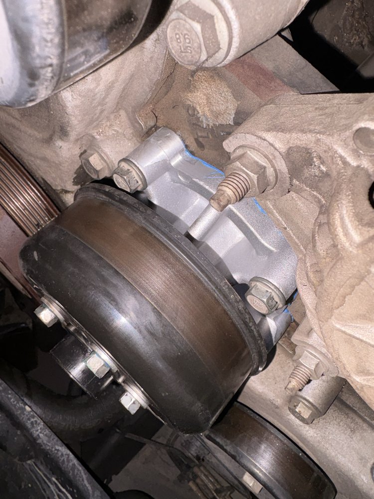 Engine bay closeup during water pump replacement